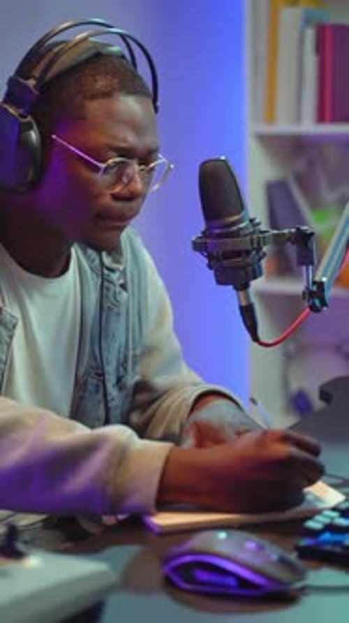 Man Working at Desk with Microphone