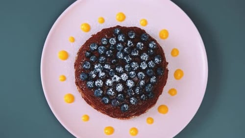 Delicious Chocolate Pancake with Blueberries and Powdered Sugar