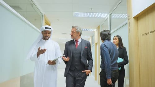 Caucasian handsome businessman employee working and walk on corridor in corporate workplace.