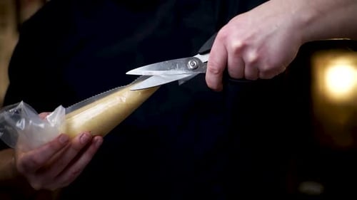 Pastry Chef Cuts Pastry Bag Tip with Scissors