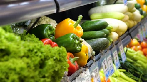 Medium Close Up of Fresh Vegetables Displayed in a Supermarket