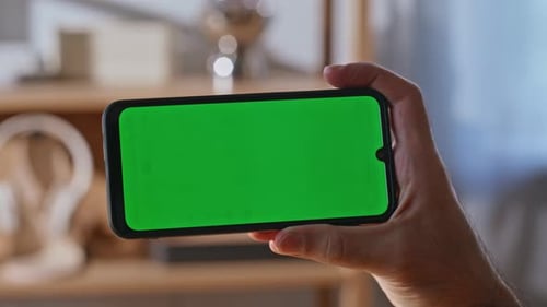 Worker Finger Swiping Mockup Smartphone at Workplace Creative Agency Closeup