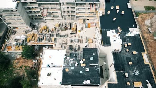 Aerial Flight Over a New Constructions Development Site. Urban Construction Site, Aerial View. High