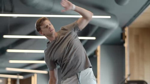 Serious Athlete Man Preparing to Crossfit at Gym. Strong Fitness Man Warming