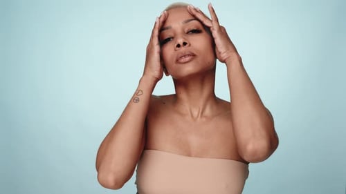 Woman Massaging Face and Neck for Skincare