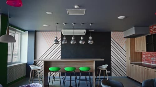 A Vibrant Office Lounge Area with a Mix of Modern and Rustic Elements It Features a Brick Accent