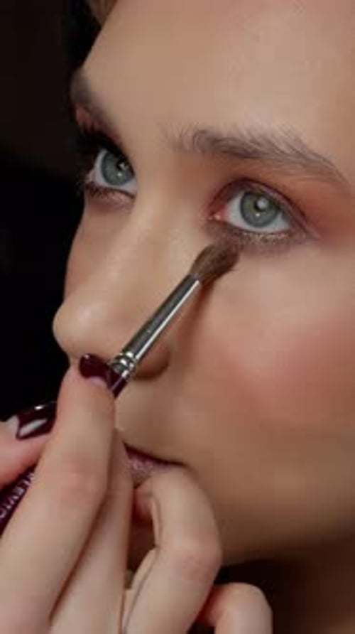 CloseUp of Eye Makeup Application A Detailed View of Eyeshadow Being Applied on a Woman s Eyelid