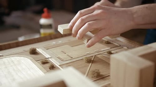 Architect Building Model of Cityscape Construction