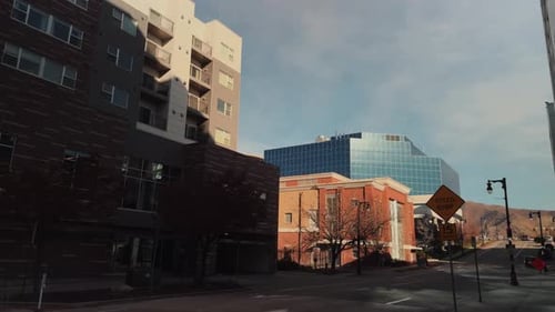 Empty Urban Street With Modern Buildings and Distant Traffic