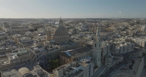 Aerial view of historic Valletta with cathedral, dome, and spires, Malta.