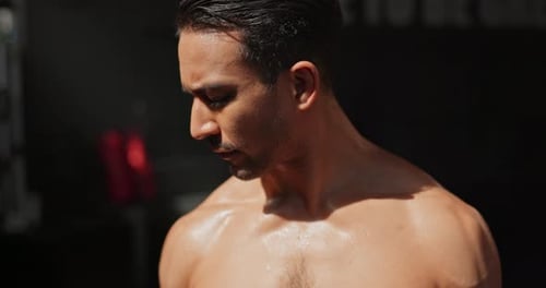 Dumbbell, workout and man in gym for muscle, wellness or sports for body health