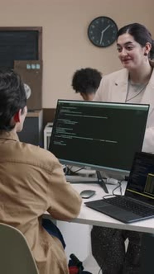 Software Engineer Speaking with Office Colleague at Workplace