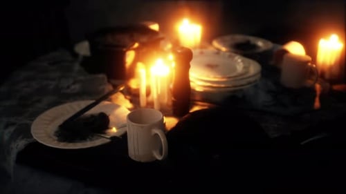 Romantic Dinner Table with Flickering Candles Warm Ambient Scene