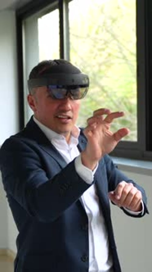 Businessman Using VR Simulator in the Corridor of a Building