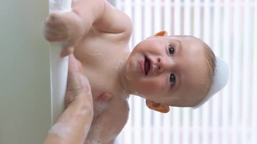Happy Baby Getting Washed During Bath Time