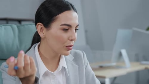 Professional Woman Working at Computer in Modern Office