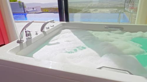 Bubbling Jacuzzi with an Infinity Pool View