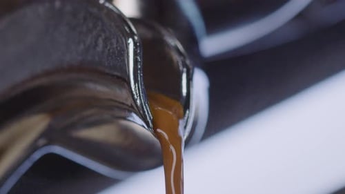 Close up of coffee maker pouring freshly brewed quality coffee in the morning. Footage of drinks and