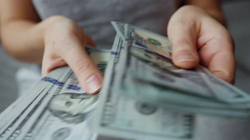 Woman Counting Money in Close Up Shot