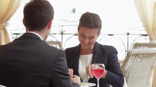 Woman Eating Salad at Outdoor Cafe