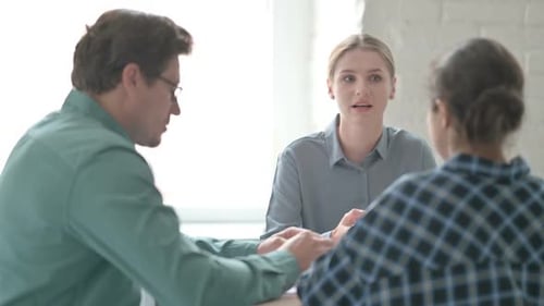 Engaged Team Meeting in Modern Office Setting