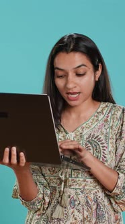 Vertical Video Woman Composing Email Carefully Typing on Laptop Keyboard