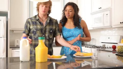 Couple Preparing Breakfast Together 20-25