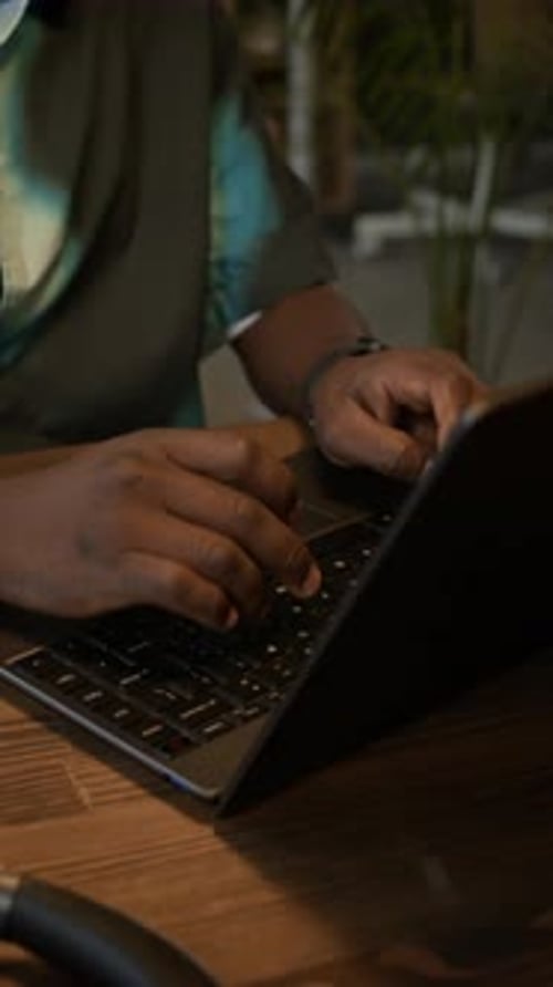 Confident Manager Working on Wireless Laptop at Office Desk