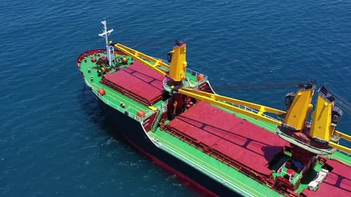 Aerial View of Cargo Ship on Blue Ocean
