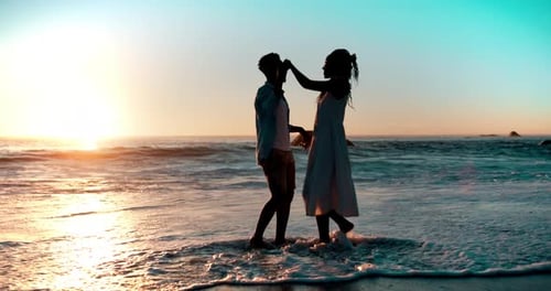 Love, dance and couple at sunset on beach together for bonding, relax and relationship