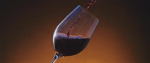 Wine Glass Filling with Red Wine Close Up