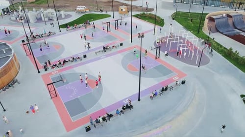 Colorful Basketball Fields with Players in City Park Aerial