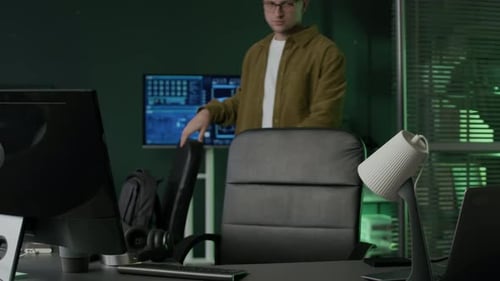 Young Male Programmer Starting to Work in Programmers Office