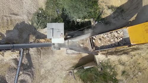 Open Pit Mining of Construction Sand Stone Materials with Excavators and Dump Trucks at Conveyor
