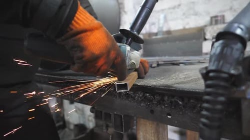 Craftsman Use Saw Cutting Machine to Cut Metal Detail Man with Circular Saw Sawing Steel in Garage