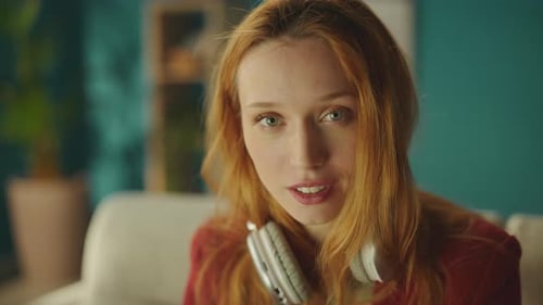 Young Woman Portrait with Headphones Smiling Indoors