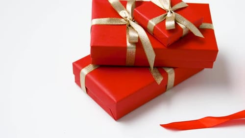 Red gifts and ribbon shaped into a heart