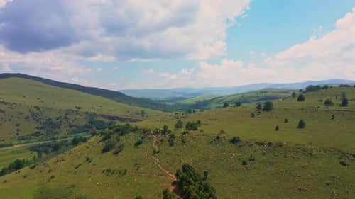 Aerial View of Green Hills and Countryside