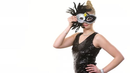 Woman Holding Masquerade Mask in Black Dress