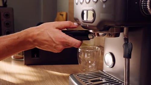 Hands Preparing Coffee with Espresso Machine at Home