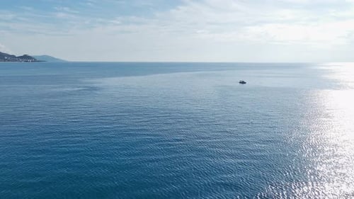 Boat Drifting on Blue Ocean Waters