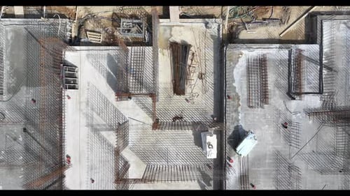 Construction Process of a New Building Project in a City Area Showing Rebar Installation
