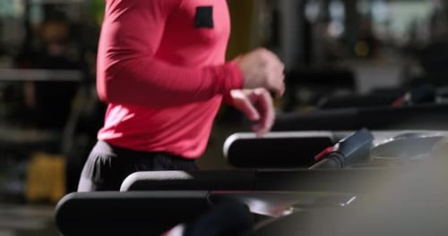 Muscular Young Man Training at Gym Guy Runs on Treadmill Confident Bodybuilder Working His Body in