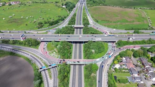 Aerial huge multi-lane circle roundabout intersection in city traffic highway. Public transport