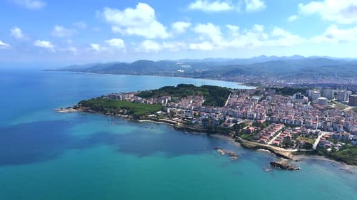Aerial View of Coastal City Meets Turquoise Water