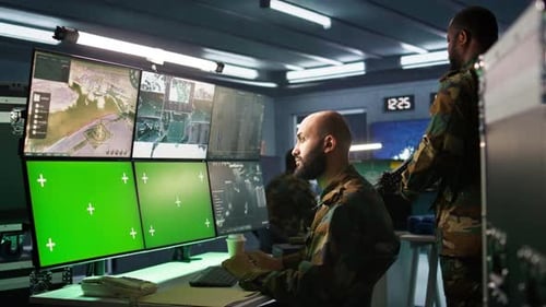 Soldiers Working with Technology in an Operations Room
