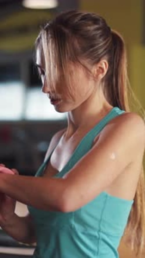 A Passionate Female Fitness Enthusiast Engaging in a Rigorous Workout at the Gym