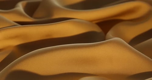 Crumpled golden silk fabric as background, closeup. Changing direction of light