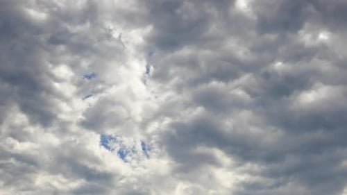 Fluffy Clouds Moving in a Sunny Blue Sky