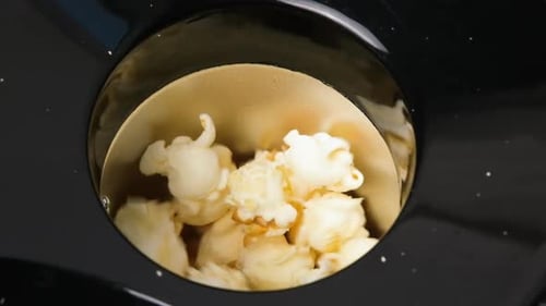 Close Up Top View on Home Popcorn Maker Making Fresh Crispy Popcorn Popcorn Popper or Machine for